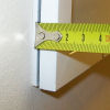 Picture of the curved edge of a fixed unit of secondary glazing.
